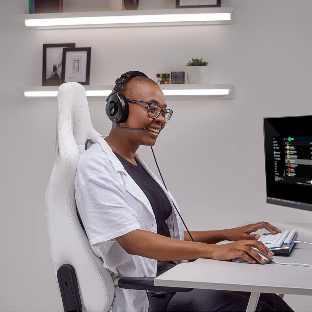 Girl wearing white in front of computer screen using NTH-100M